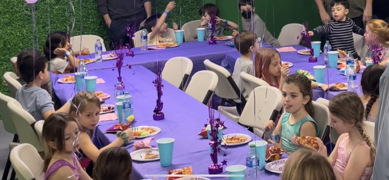 Gymnastics birthday party for kids, kids gymnastics party, Birthday Party - kids at purple table having food