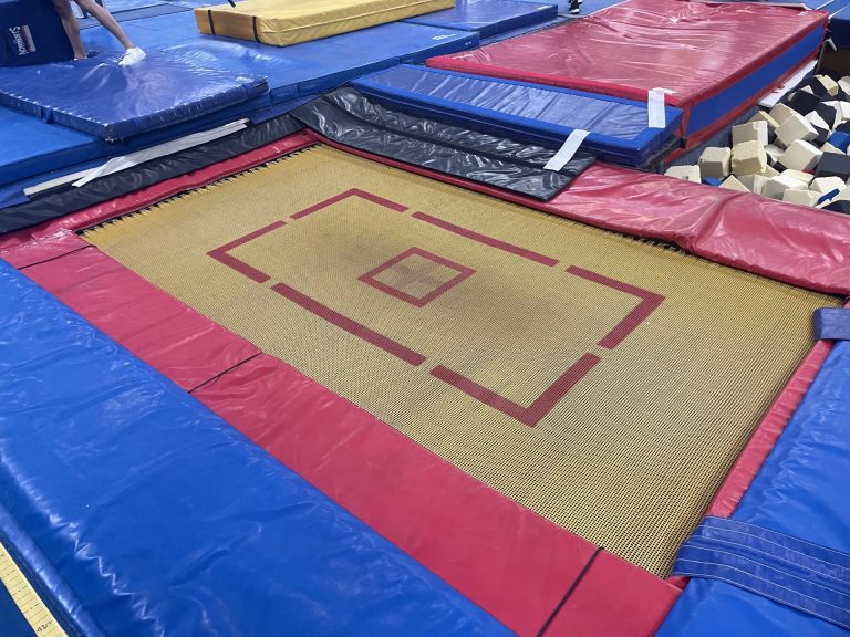 Gymnastics Facility with gymnastics equipment Colorful Mats - In ground yellow Trampoline