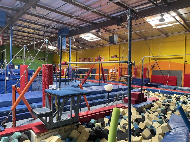 Gymnastics Facility with gymnastics equipment Colorful Mats - High Bar Over the foam Pit